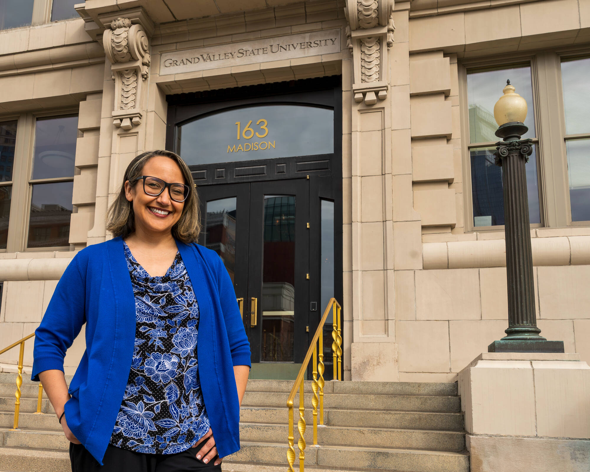Shawntae Mintline, GVSU's director of Southeast Michigan, in front of the Detroit Center